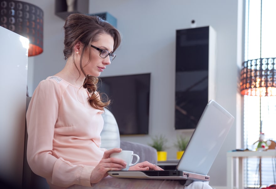 Brunette woman working with the laptop