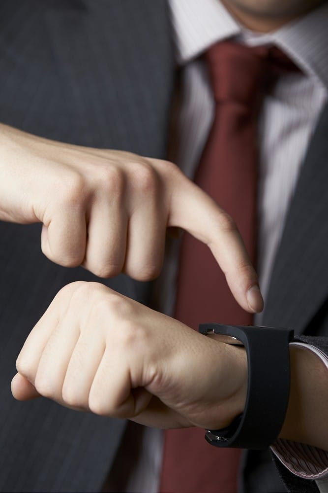 Close Up Of Businessman Using Smart Watch